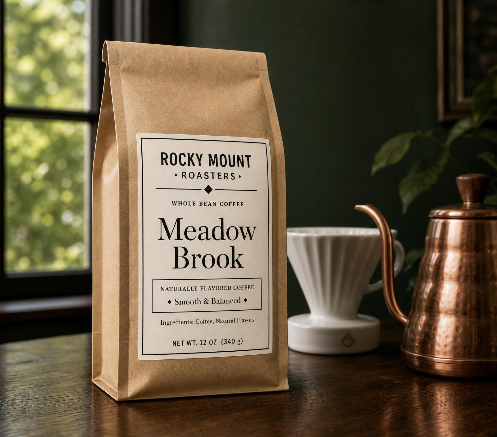 Kraft coffee bag beside a ceramic pour-over and copper kettle in morning light